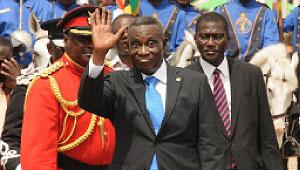 Ghanau2019s President John Evans Atta Mills waves at the media during the countryu2019s 55th independence anniversary celebrations at the Independence Square in Accra, capital of Ghana, Mar. 6. Xinhua