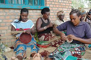 Rwandan women weaving. It is through hard work that Africa can wean itself off aid. The New Times / File.