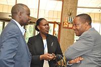 ICGLR head, Prof. Lumu Alphonse Ntumba Luaba (R), talks to Prosper Higiro of the bodyu2019s parliamentary forum as Diana Ofwono (centre) from the UN looks on.  The New Times / Gashegu Muramira.