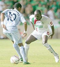 Hamad Ndikumana (R) against Brazilu2019s Robinho in a Europa Cup tie during his stint in Europe. The New Times/File.