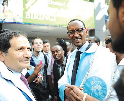 President Paul Kagame, with Rector Prof. u015eerif Ali Tekalan and students of Fatih University, after receiving an Honorary Doctorate from the Turkish varsity, yesterday. The New Times / Village Urugwiro.