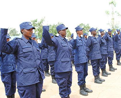 Police officers take Oath of  allegiance after being conferred upon the rank of Police Constable yesterday. The New Times / courtesy. 