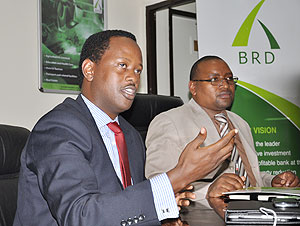 BRD CEO Jack Kayonga (L) and  the banku2019s board chairman Fabien Majoro at a meeting last week. The New Times / courtesy. 