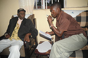 The New Timesu2019 Eric Kabeera (R) during an interview with Mzee  Athanase Rwagiriza Sentore. The New Times / File.