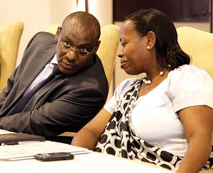 Amb. Claver Gatete (L), the Governor of the National Bank of Rwanda, and Deputy Governor, Monique Nsanzabaganwa,  at a regional bankersu2019 meeting in Kigali yesterday. The New Times / Timothy Kisambira.