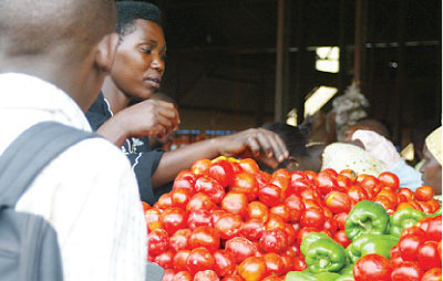 A food vender in Kimironko market in Kigali. The New Times File.