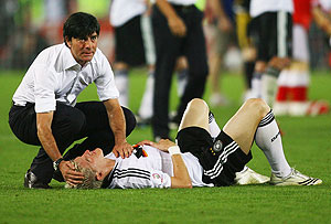 Joachim Loew comforts Bastian Schweinsteiger after the Uefa Euro 2008 Final match between Germany and Spain at Ernst Happel Stadion in Vienna, Austria.