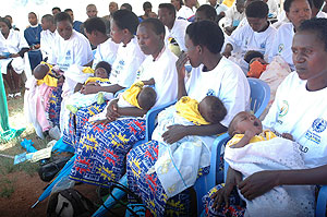 A group of mothers await immunisation of their infants. CHWs play an important role in such drives. The New Times /  File.