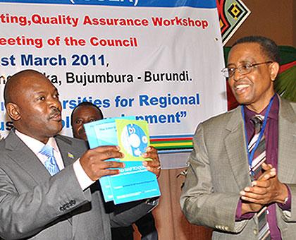 Burundi President Pierre Nkurunziza (L) with Prof. Silas Lwakabamba, rector, National University of Rwanda, during a past IUCEA meeting in Bujumbura. The Sunday Times / Courtesy.  