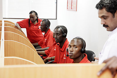 Airtel workers attending to clients from a call centre.  The New Times / File.