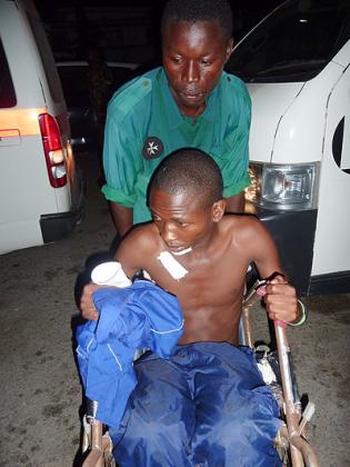 A victim from a grenade attack arrives at a hospital in Mombasa, Kenya, March 31, 2012. Xinhua .