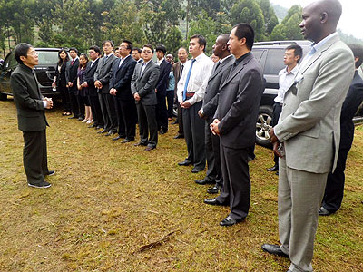 Chinese Ambassador to Rwanda, Shll Zhan (L) addressing members of the Chinese community Wednesday at Rulindo Chinese cemetery. The New Times / G. Mugoya.