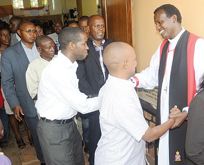 EASTER BLESSINGS: Bishop Louis Muvunyi wishes Christians a happy Easter after prayers at St. Etienne Cathedral yesterday.The New Times / John Mbanda.