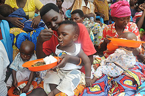 Mothers feeding their children during a recent campaign against malnutrition. The New Times / File.