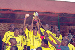 Mukura VS players celebrate after retaining their club-organised Genocide memorial tournament back in 2005.  The New Times / File.