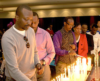 A procession of Rwandans and friends of Rwanda light candles at the genocide commemoration in Stockholm on Saturday. Courtesy photo.