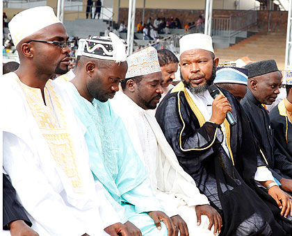 Grand Mufti, Sheikh Abdul Karim Gahutu (Centre with microphone) leading prayers at Nyamirambo Regional Stadium during IDI-Fitri. The New Times / File.