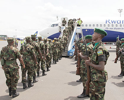 RDF soldiers board a Juba-bound RwandAir flight, at Kigali International Airport yesterday. They will be part of an 850-strong Rwandan contingent that will serve under the UN Mission in South Sudan. The New Times / Timothy Kisambira.