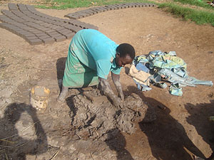 DETERMINED: One of the coop's members making bricks in Mukoni village, Tumba sector of Huye District. The New Times / JP Bucyensenge.