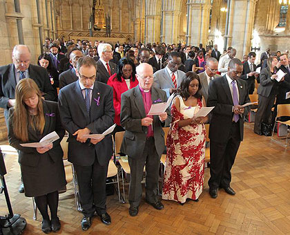 Mourners at a commemoration event in the UK on Wednesday. The New Times / Courtesy.