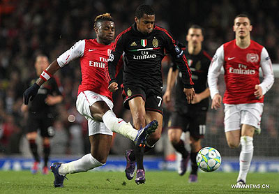 Robinho vies with Alexandre Song during their UEFA Champions League match in London. Arsenal won 3-0. Xinhua-Tang Shi