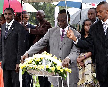 Chief Justice Sam Rugege laying a wreath in respect to the 1994 Genocide Victims at Rebero Genocide Memorial centre on Friday, while Jean de Dieu Mucyo (L), the Executive Secretary of CNLG looks on. The Sunday Times/ Timothy Kisambira.