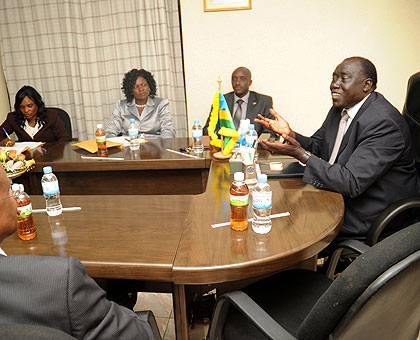 Minister Tharcisse Karugarama (R) meeting the Zimbabwean delegation at his office yestersday. The New Times/ John Mbanda.