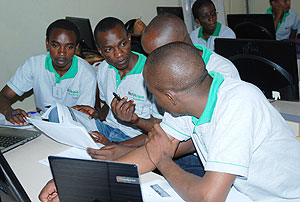 NetHope student beneficiries consulting each other during the boot camp training. The New Times / Courtesy.