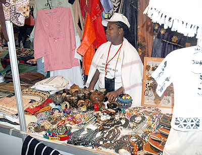 A woman entrepreneur displays crafts during last yearu2019s Jua Kali expo in Kigali. The New Times / File.