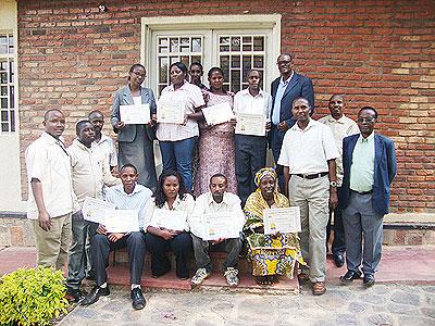 Some of the cooperative members pose with their certificates after undergoing a training. The Sunday Times / Susan Babijja