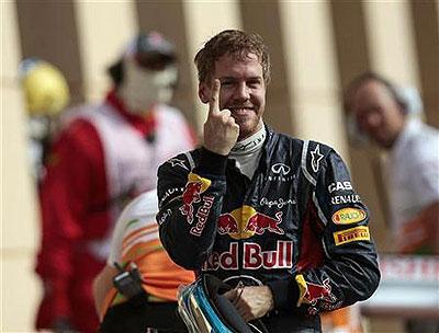 Red Bull Formula One driver Sebastian Vettel of Germany gestures after taking pole position. Net photo.