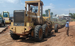 A grader works on a local road. Outdated infrastructure remains one of the biggest challenges for investors in Africa. The New Times / File.