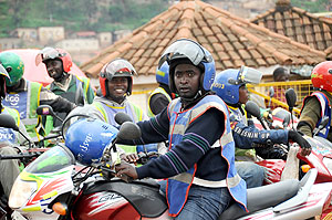 Motocyclists are reluctant to avail smart head covers to their passengers. The New Times / File.