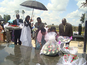 TRIBUTE: Mourners lay wreaths on the Queen's tomb at Mwima hill, Nyanza District.  The New Times / JP Bucyensenge.