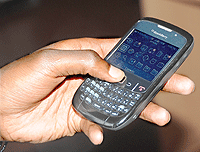 More people in the EAC region are embracing mobile phones . The New Times / File.