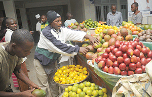 Fruit vendors at a Kigali market. Food commodity prices witnessed a reduction at the end of last month.  The New Times / John Mbanda.