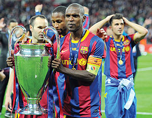 Silverware: Abidal lifts the famous trophy at Wembley. Net photo.