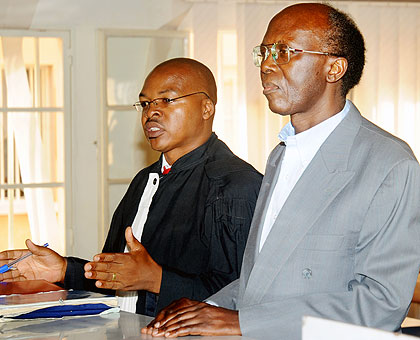 Lu00e9on Mugesera (R) and his lawyer. The New Times / File.