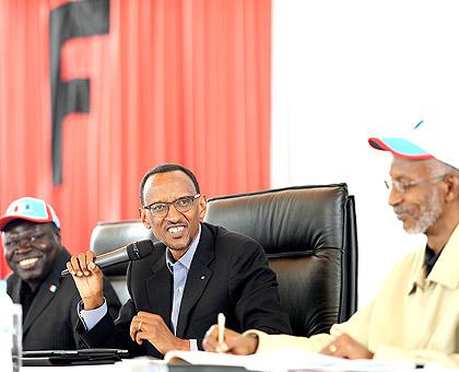 President Kagame flanked by RPF Vice Chairman, Christophe Bazivamo (L) and RPF Secretary General, Franu00e7ois Ngarambe at the meeting yesterday. The Sunday Times / Village Urugwiro.