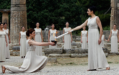 The Olympic flame is lit at the site of ancient Olympia. Net photo.