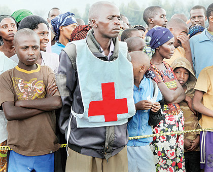 A Red Cross volunteer in Nkamira refugee transit camp. The New Times / File.