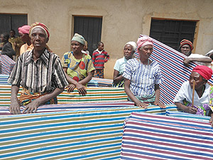 The university donated mattresses to the most vulnerable people in Mucunda village.  The New Times / JP Bucyensenge.