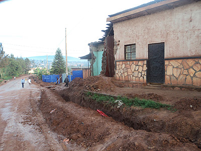 One of the houses that were partly demolished to pave way for the construction of the road. The New Times / Jean Mbonyishuti.