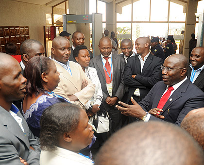 Prime Minister Pierre Damien Habumuremyi engages district Mayors in discussion at the parliamentary conference on corruption yesterday. The New Times / John Mbanda.