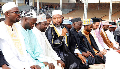 Grand Mufti Sheikh Abdul Karim Gahutu (with a microphone), leading prayers at Nyamirambo regional stadium. The New Times / File.