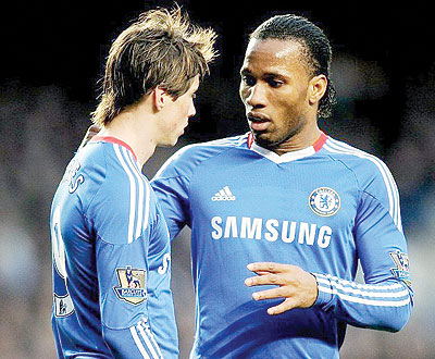 Drogba (R) has confirmed he will leave Chelsea this summer but Torres (L) will not. Net photo.