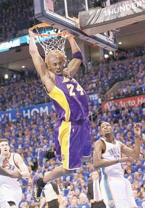 BEATEN AND OUT: Kobe Bryant  of the Los Angeles Lakers gets a slam dunk against the Oklahoma City Thunder during Game Five. Net photo.