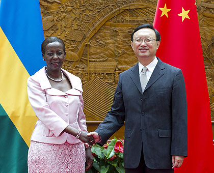 Minister of Foreign Affairs and Cooperation, Louise Mushikiwabo shakes hands with Chinese Foreign Minister, Yang Jiechi in Beijing. The New Times / Courtesy.