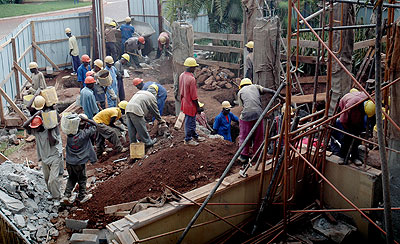 Workers at a construction site. The New Times / File.