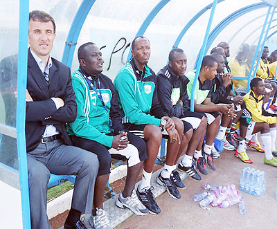 Amavubi coach Micho (left) and his technical staff look on helplessly during Sunday's friendly match against Tunisia. The New Times/B. Mugabe.